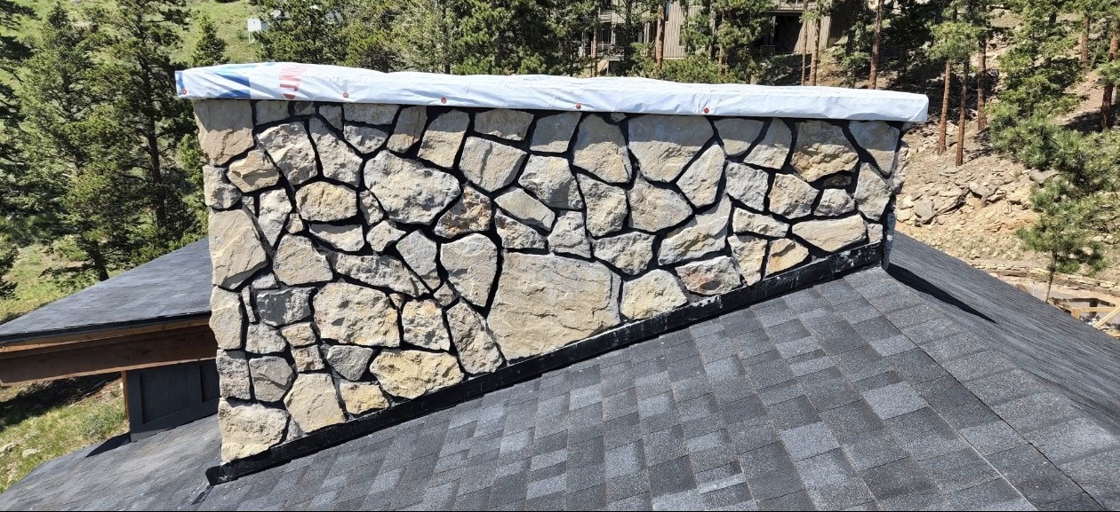 Custom stone chimney masonry by FTK Construction in Northern Colorado
