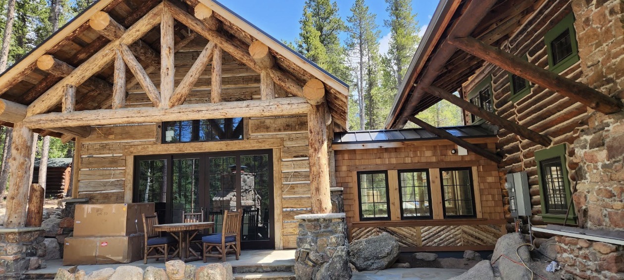 Custom log cabin home build with timber framing and stonework, Northern Colorado